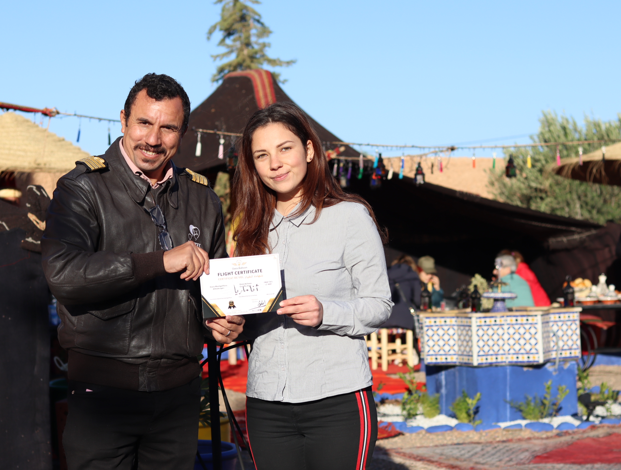 A passenger with her hot-air balloon certificate